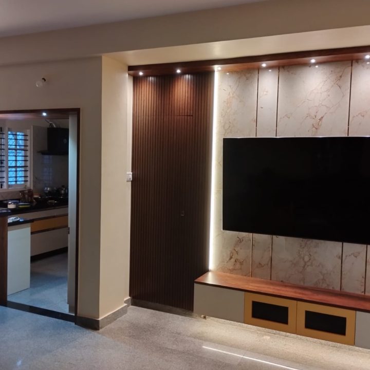 stylish floating TV unit design featuring wall-mounted storage for a clean and spacious living room layout