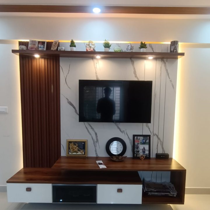 custom TV unit by KreativeNest with elegant shelves and drawers, enhancing your living room's aesthetics